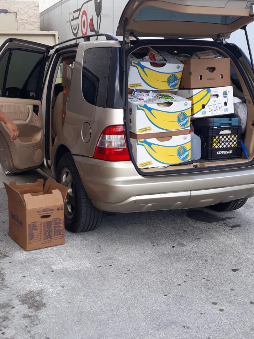 Packing up the van with groceries from Whole Foods with United We All can for the homeless